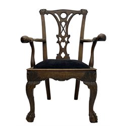 Unusual 18th century mahogany elbow chair, the shaped cresting rail with projecting shell carved ears, pierced and scroll carved splat over drop-in upholstered seat, shaped arms with ball and claw carved terminals, the seat rails carved with shell cartouches, on foliate carved cabriole supports with ball and claw feet 