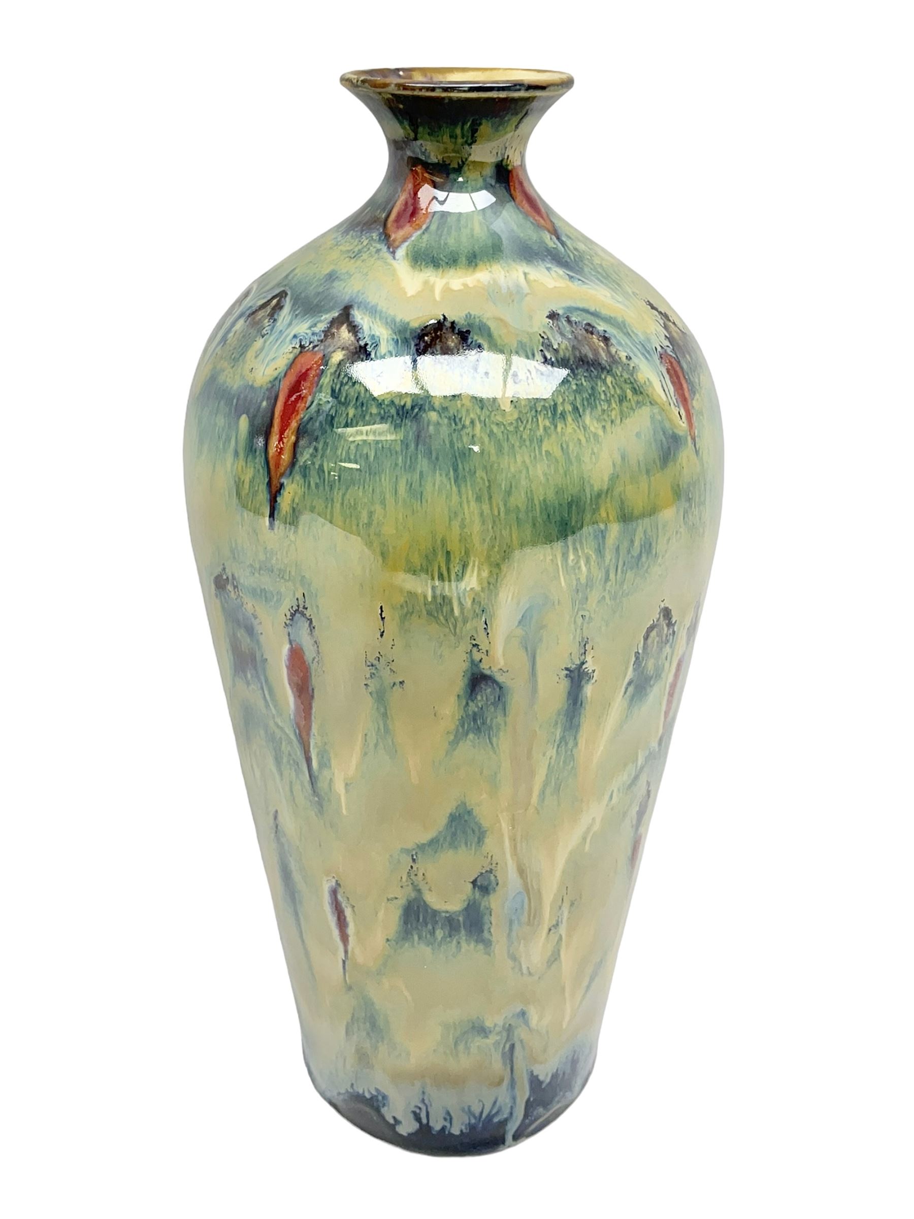 Cobridge Stoneware vase of bluster form by Andrew Hill, decorated in layered dripping blue red and brown glaze, with impressed and painted mark beneath 