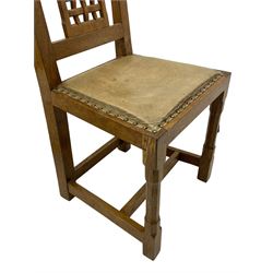 Rabbitman - set of six (5+1) oak dining chairs, pierced and carved lattice back, leather upholstered seat with stud band, on octagonal supports united by stretchers, carved with rabbit signature, by Peter Heap of Wetwang 