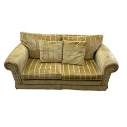 Duresta England - two-seat sofa, upholstered in pale gold fabric, traditional shape with rolled arms