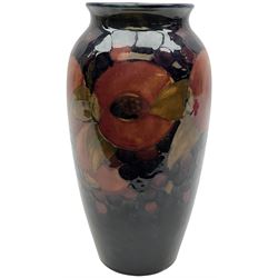 Moorcroft vase of shouldered ovoid form decorated in the 'Pomegranate' pattern upon dark blue ground, impressed and green painted marks beneath, H25.5cm