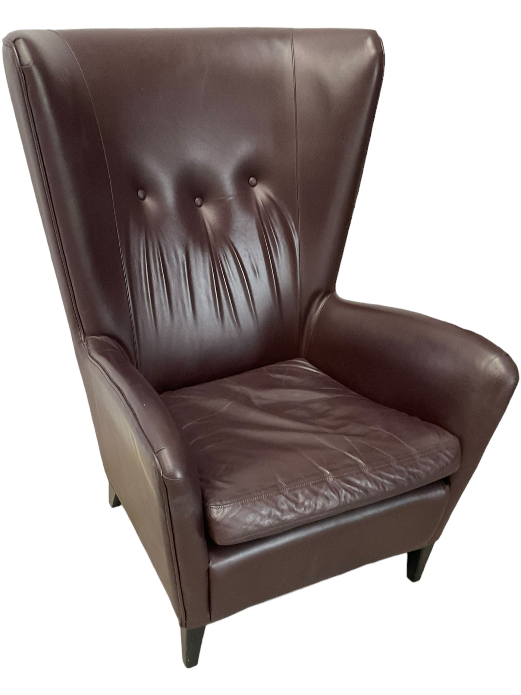 Wing back armchair upholstered in cocoa brown leather