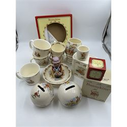 Royal Doulton Bunnykins teawares, including teacups and saucers, egg cup, money boxes etc (12)