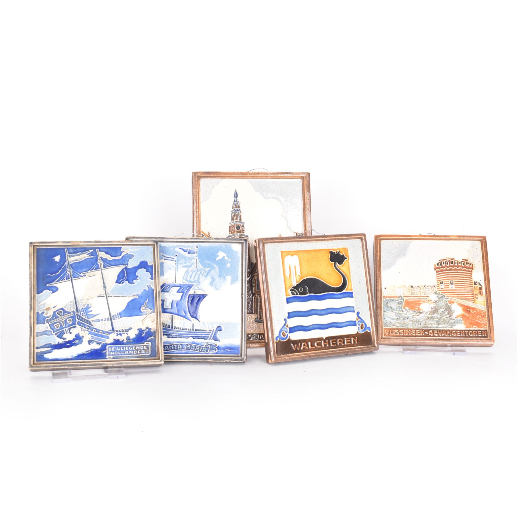 Five Dutch Westraven tiles, to include four square examples depicting maritime and similar scenes, and a rectangular example depicting a village scene, square tiles 10cm x 10cm, rectangular tile 15cm x 10cm