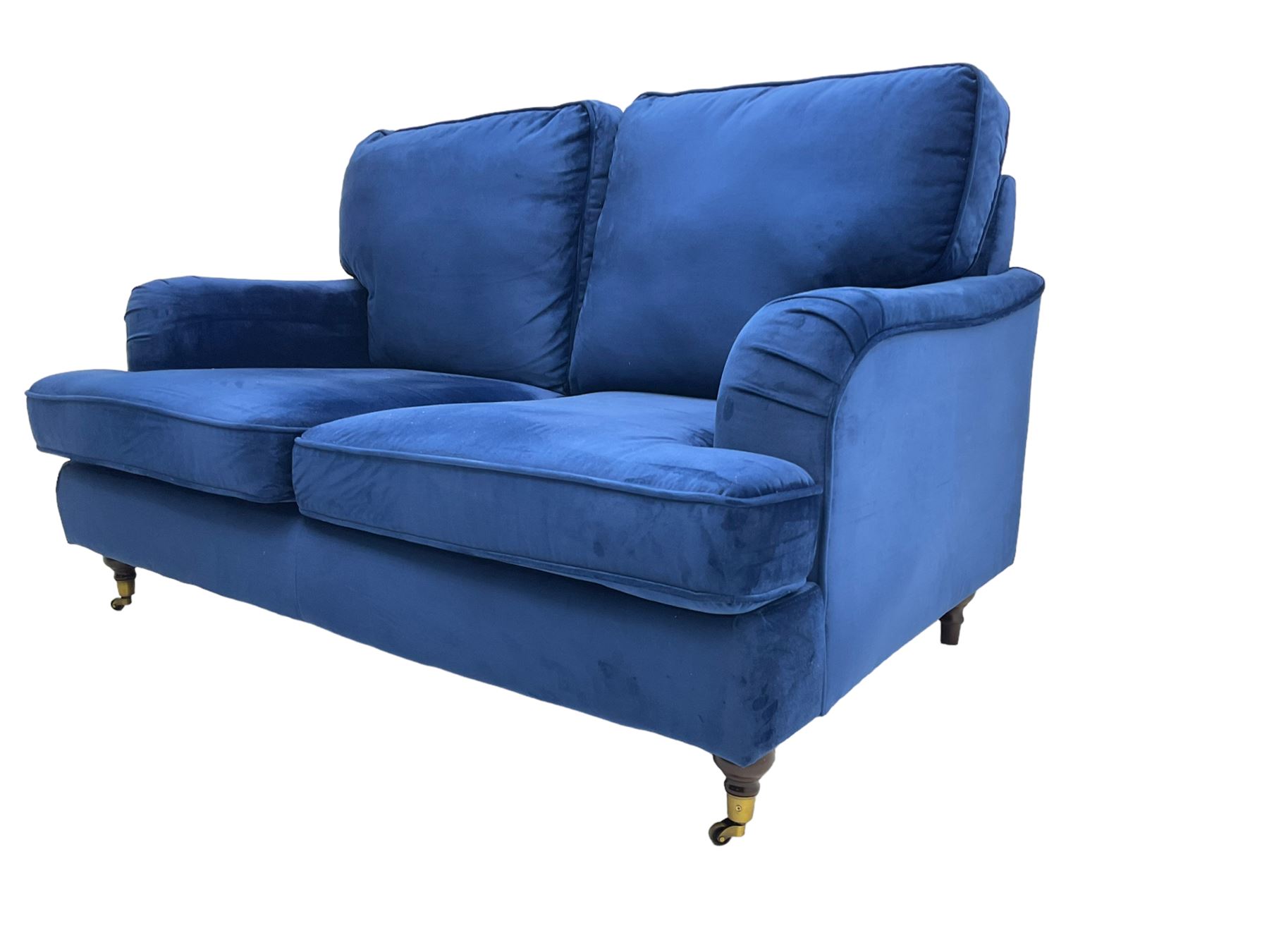 Howard design - two-seat sofa upholstered in blue fabric, traditional shape with rolled arms, on walnut finish turned feet with brushed metal cups and castors