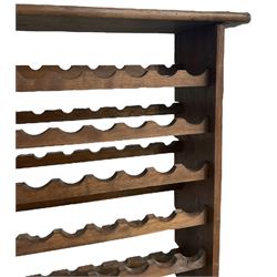 Large reclaimed oak eight tier wine rack, rectangular top over eight racks each with ten bottle divisions, on end supports