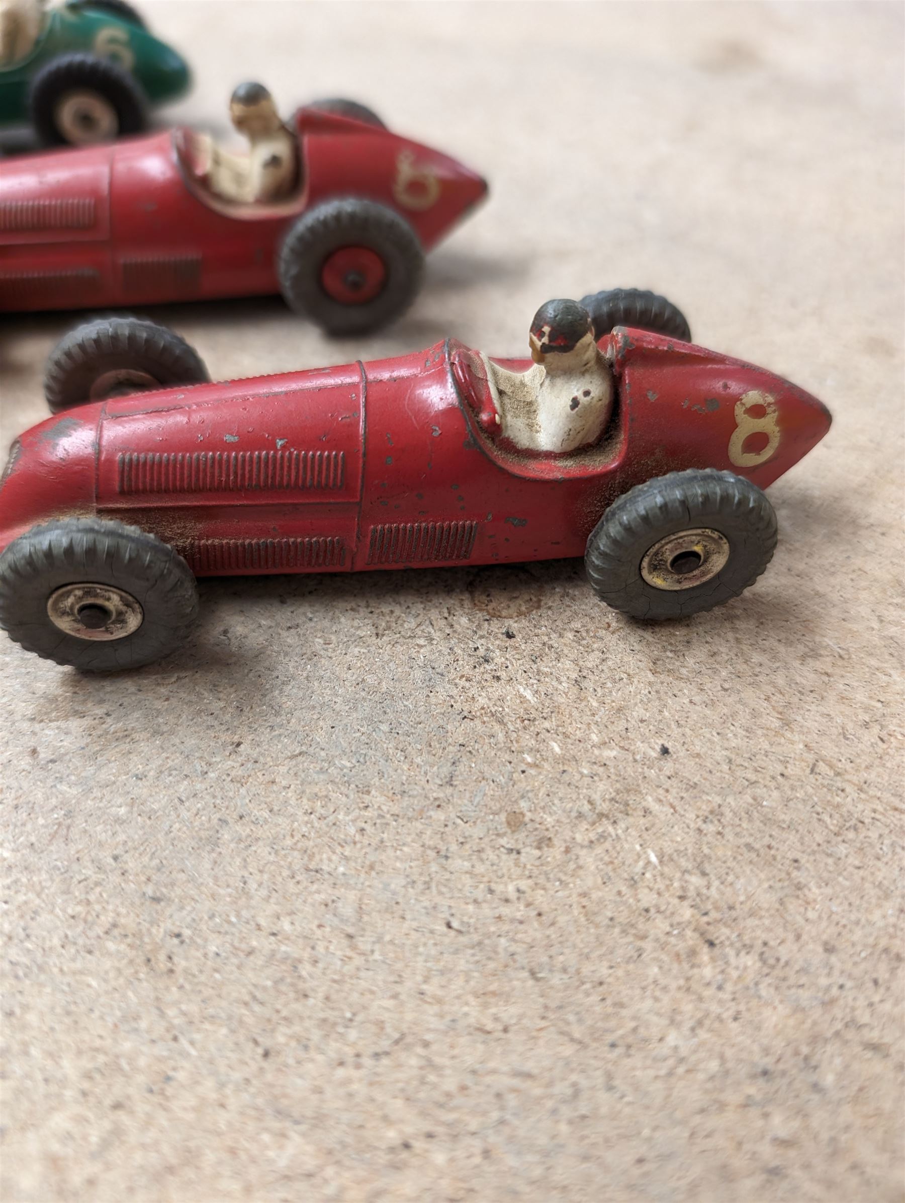 Four Dinky race cars, to include Cooper Bristol, two Alfa Romeos and a Vanwall