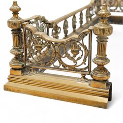 19th century brass fire fender, scrolling acanthus leaf and torch panels to the front and returns, enclosed by four reeded pillars with finials, on moulded curb base 