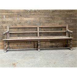 Victorian pitch pine bench pew, turned arms and legs, rail back with plank seat, 249cm