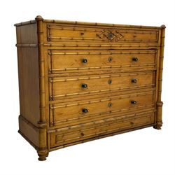 Victorian pine and simulated bamboo chest, fitted with five drawers, the drawer fronts decorated with applied simulated bamboo mounts and turned ebonised handles, on turned front feet