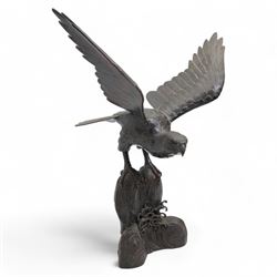 Japanese Meiji bronze eagle, raised upon a rock with crashing waves at the base, stood with outstretched wings H37cm