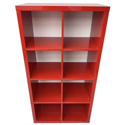 Modern red lacquered bookcase or shelving unit, with eight evenly divided compartments, finished in a high-gloss lacquer