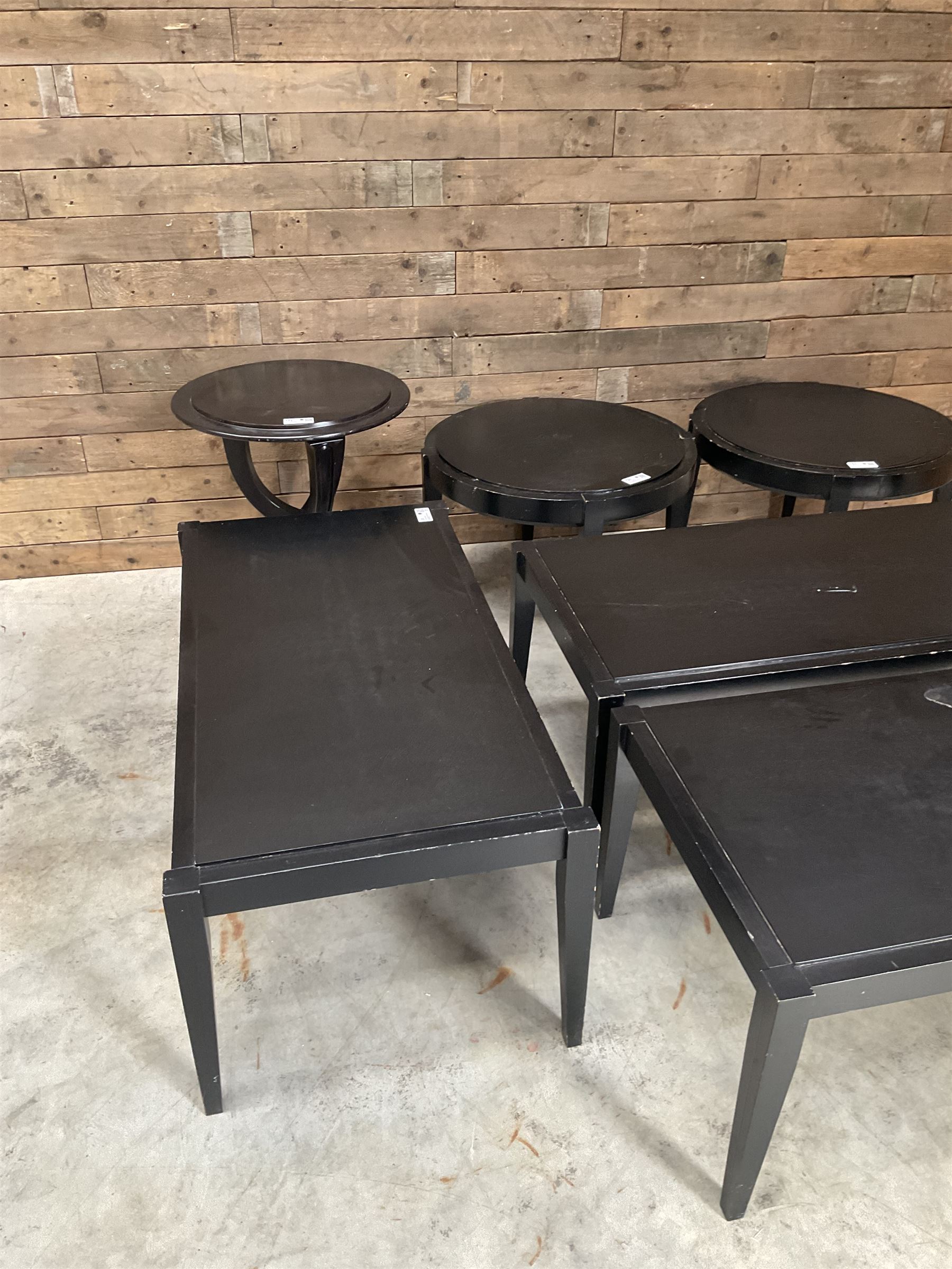 Three rectangular ebonised coffee tables and three circular tables