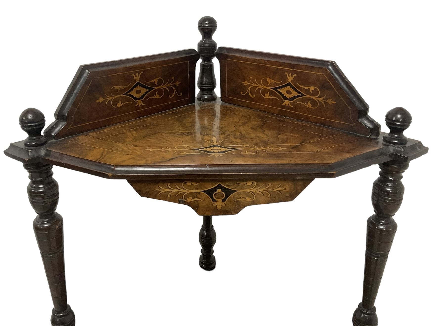 Victorian inlaid walnut corner four-tier whatnot, raised back over four graduating tiers of triangular form, decorated with satinwood and ebony inlays, united by tapering ring turned uprights, on castors