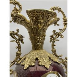 Twin handled vase, the ceramic urn form body decorated with floral sprigs and figural panel, the metal handles designed as vines, together with a similar ewer, vase H75cm 