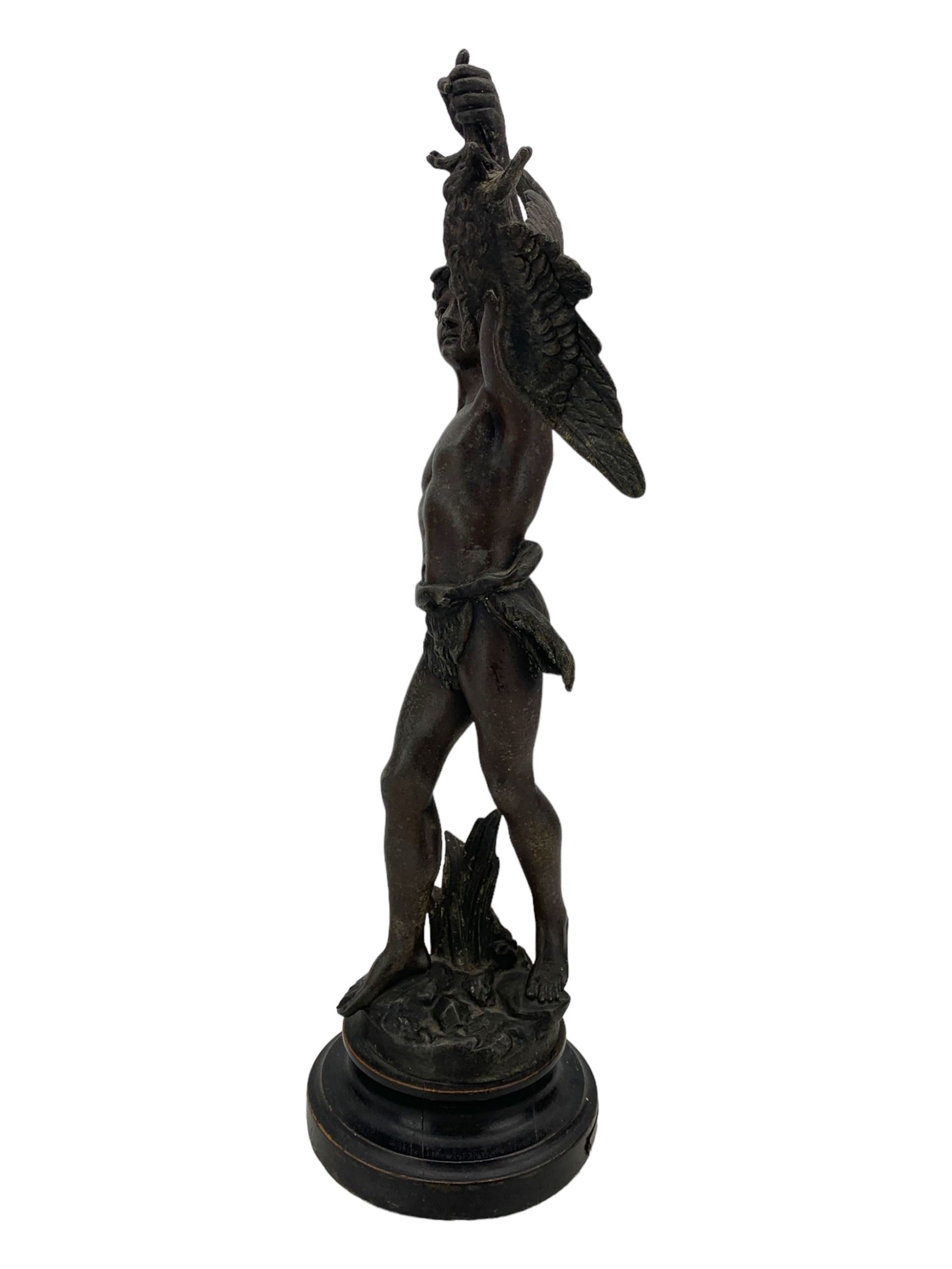 19th century French spelter figure 'Chasseur D'Aigles' on wooden base H48cm and a beaten copper circular tray inscribed with initials D61cm