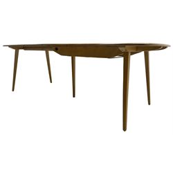 Ercol - light elm and beech 'Slide Leg Expanding Dining Table (444)', rectangular top with rounded corners, raised on tapered splayed supports, with two additional leaves