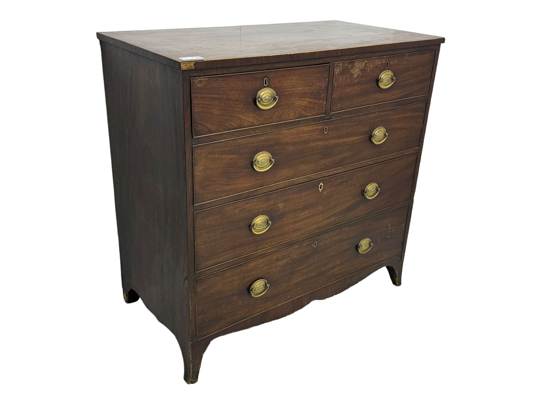 George III mahogany chest, rectangular cross banded top above two short and three long graduating cockbeaded drawers, shaped apron with splayed bracket feet