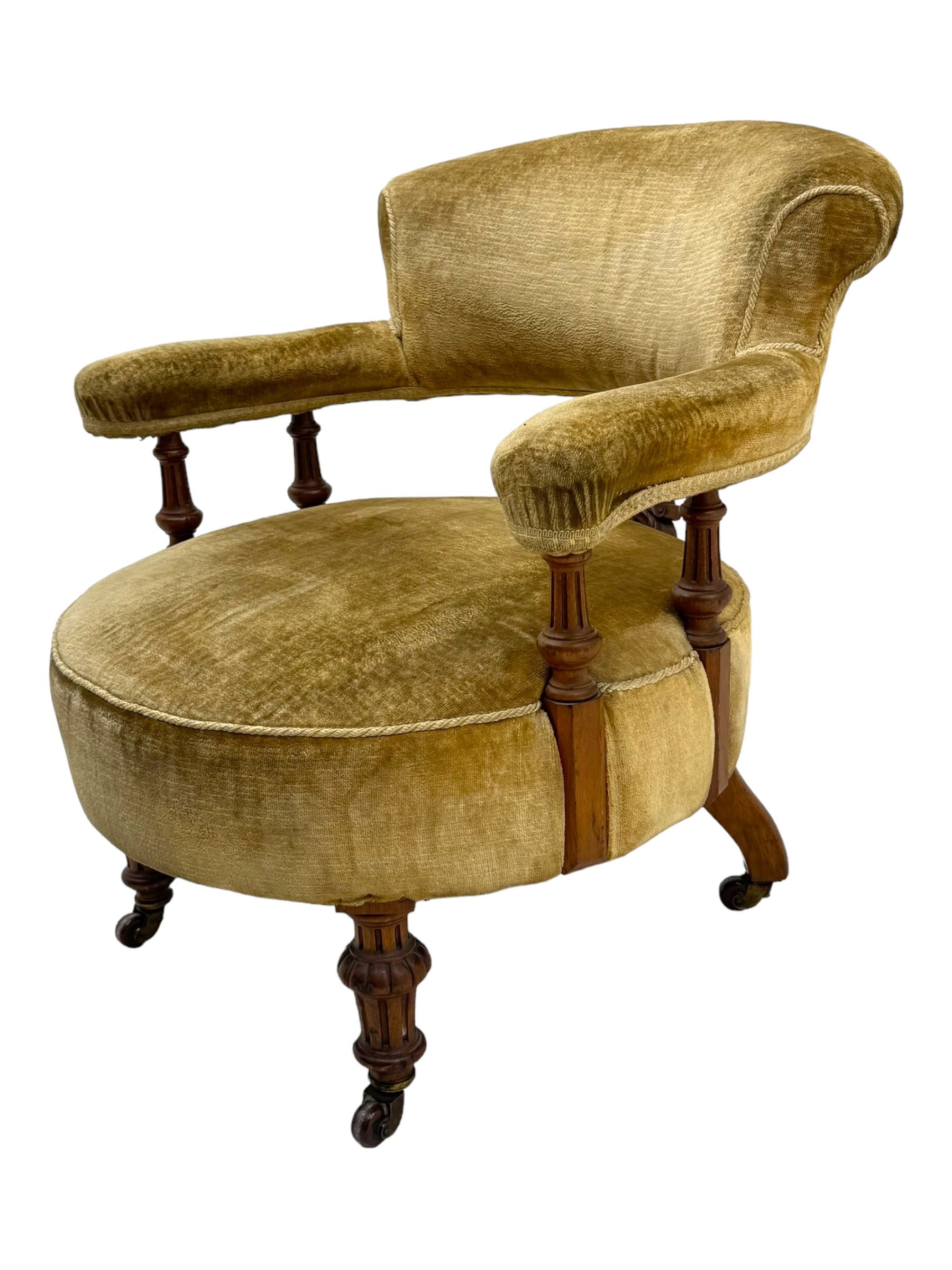 Victorian pair of mahogany armchairs, upholstered in gold velvet fabric, each with curved back, pierced splat and scroll arms, one with rounded seat and the other square, on turned front supports with castors