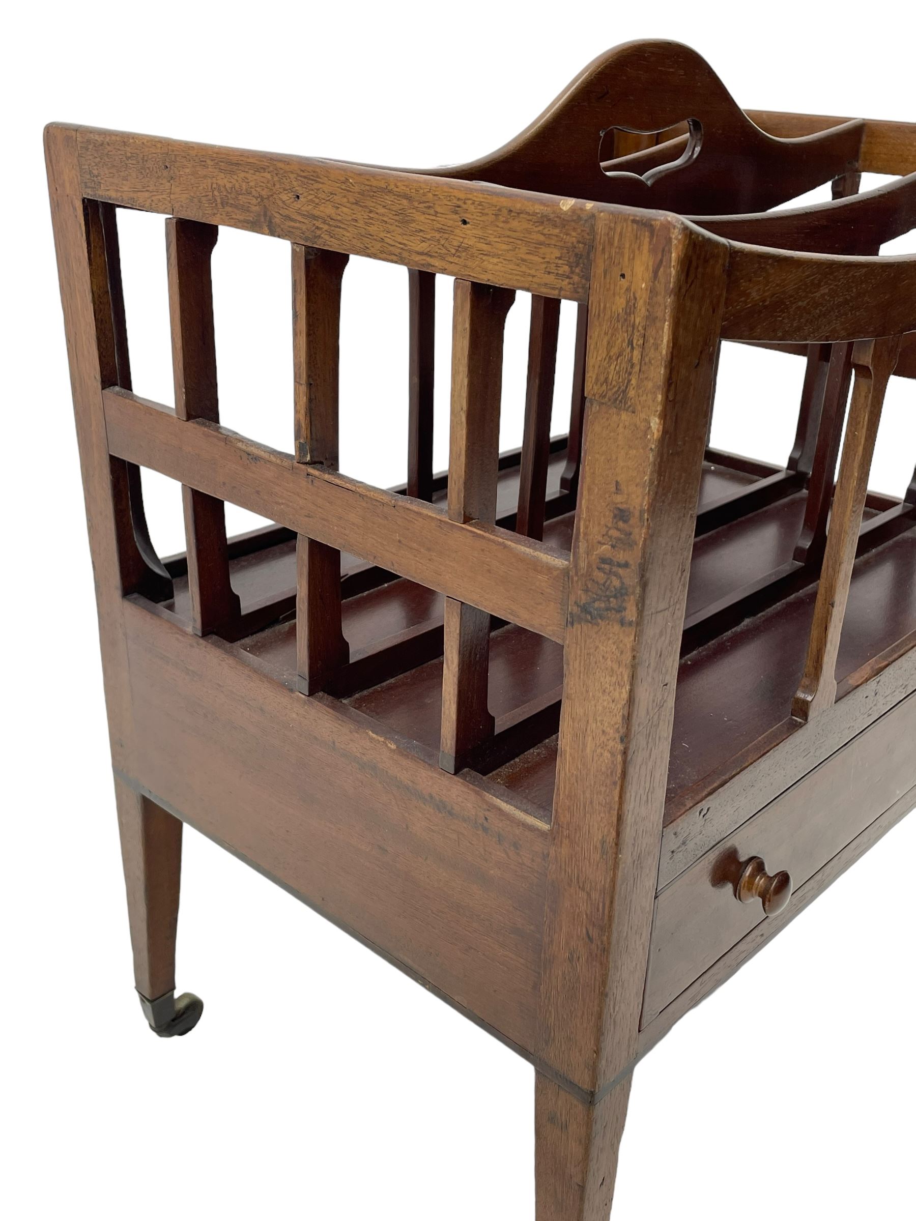 George III mahogany Canterbury, four divisions, fitted with single drawer with turned handles, on square tapering supports with brass cups and castors 