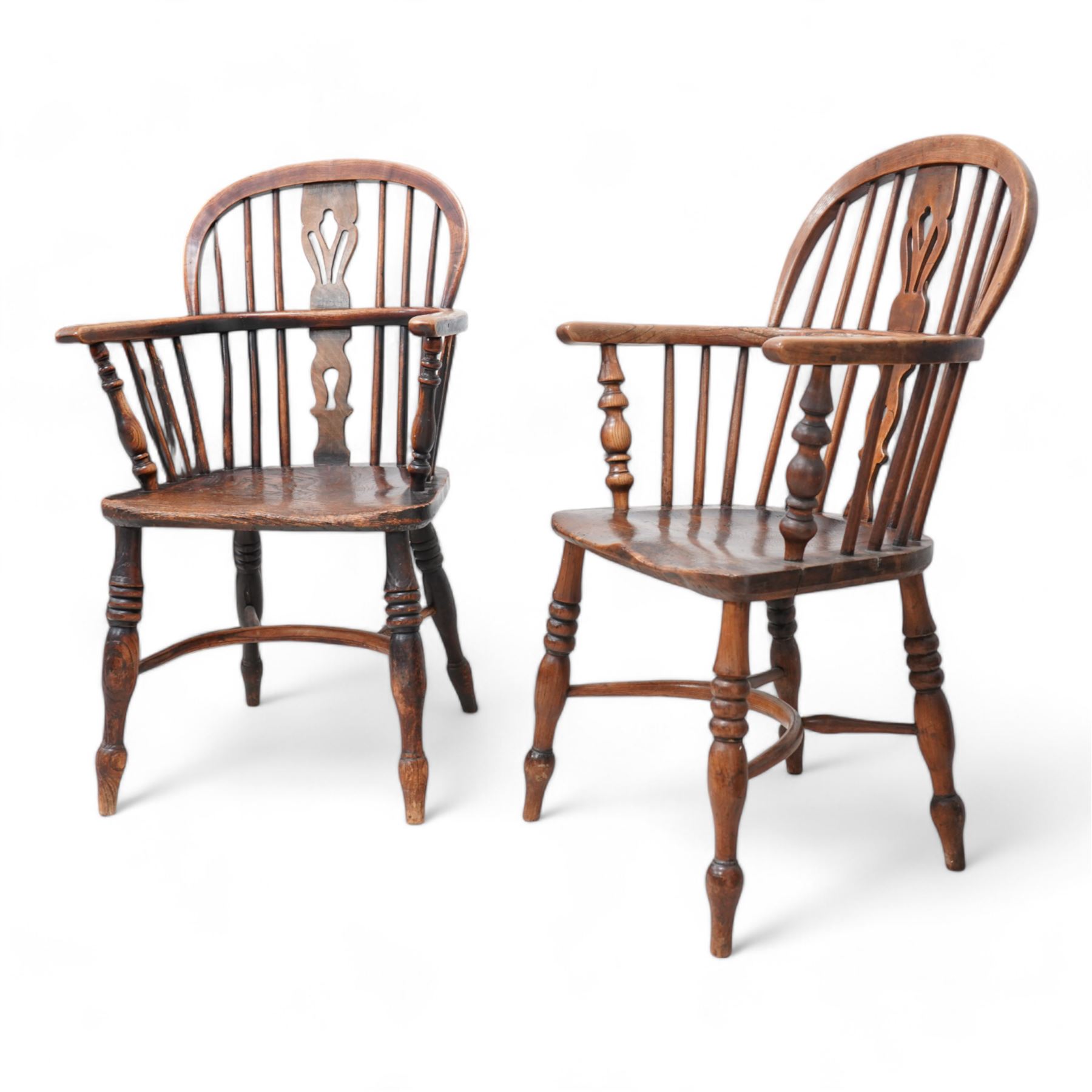 Near pair of 19th century elm and ash Windsor armchairs, each with double hoop and stick back with shaped and pierced splat, dished seat on turned supports united by crinoline stretcher 