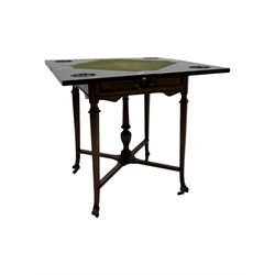 Victorian rosewood envelope games table, the moulded square top with four triangular hinged leaves, revealing inset baize playing surface and sunken counter wells, fitted with single frieze drawer, on square tapering supports united by x-framed stretchers and turned central column, on brass and ceramic castors 