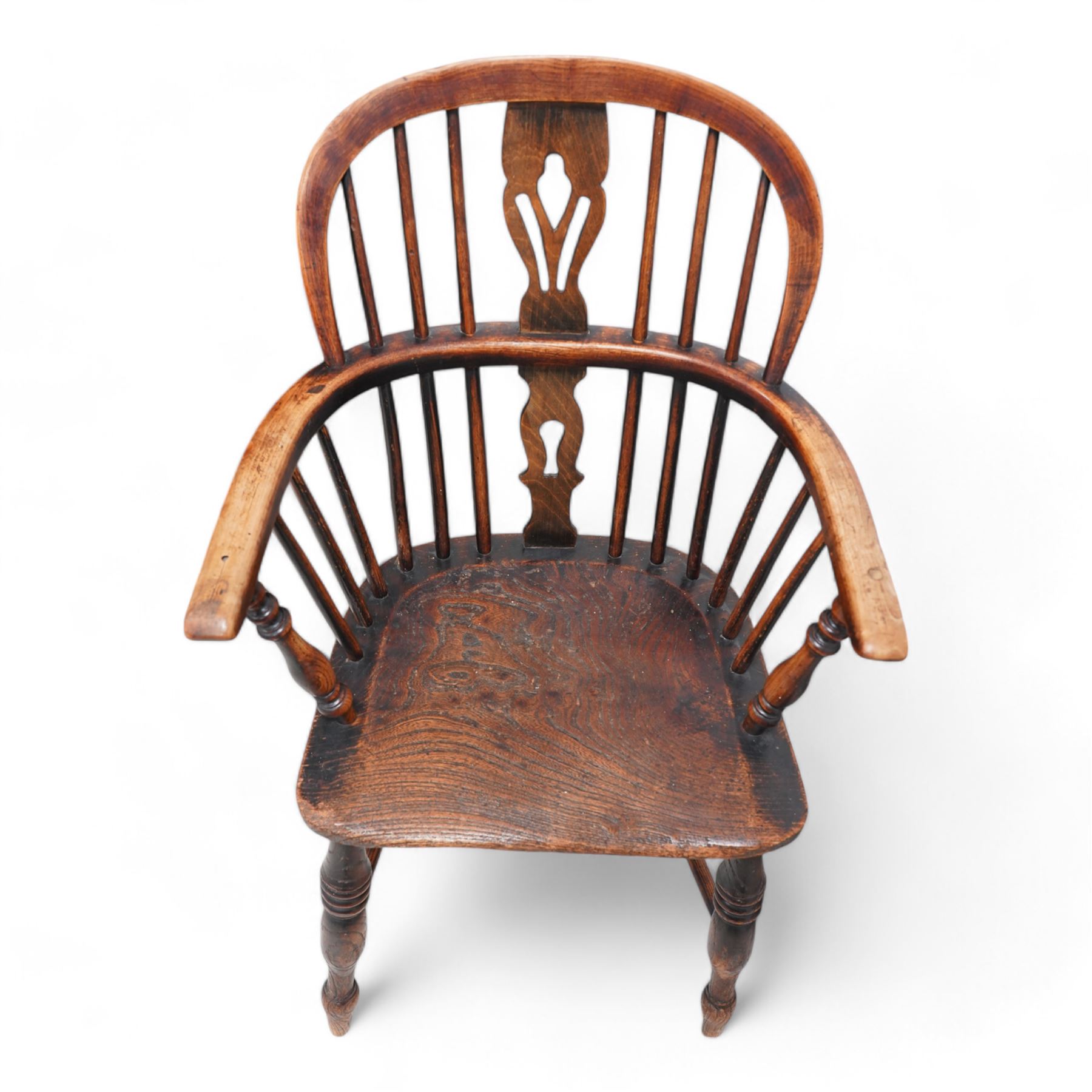 Near pair of 19th century elm and ash Windsor armchairs, each with double hoop and stick back with shaped and pierced splat, dished seat on turned supports united by crinoline stretcher 