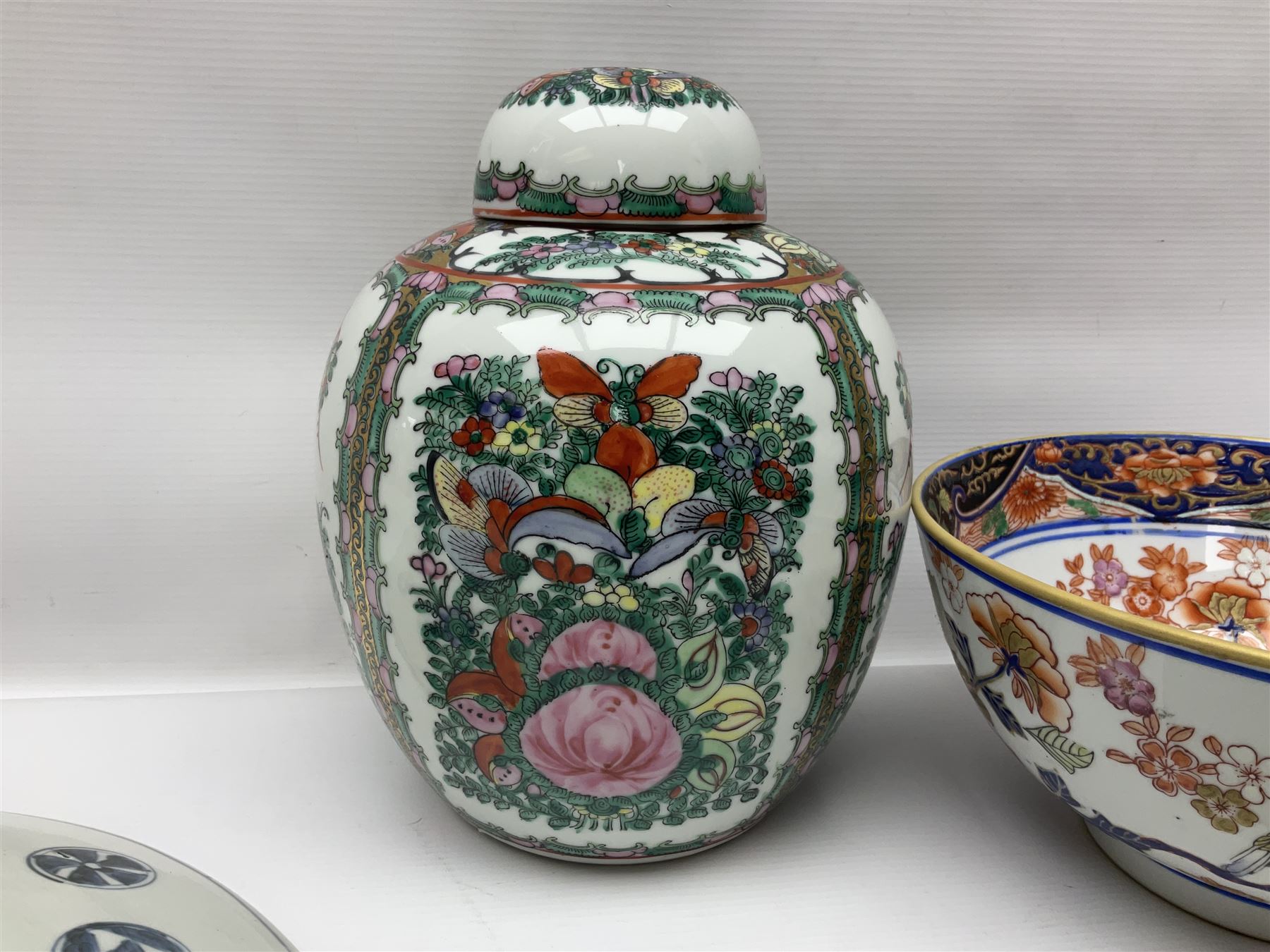 19th century and later Chinese ceramics, to include charger, with hand painted floral and foliate decoration, footed bowl, decorated in enamel with birds amongst prunus blossom,  a smaller plate decorated with figural panels and a ginger jar with cover, with hand painted floral decoration and four character marks beneath, charger D40.5cm