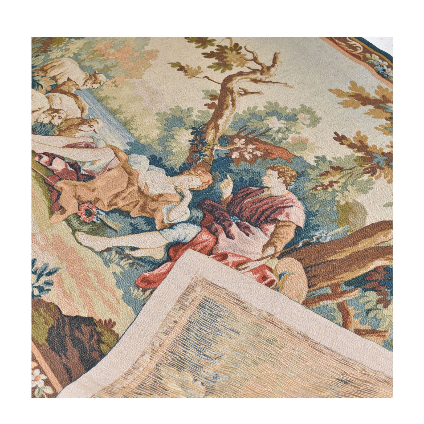 Large French machine woven tapestry, depicting figures in a landscape with a floral boarder 