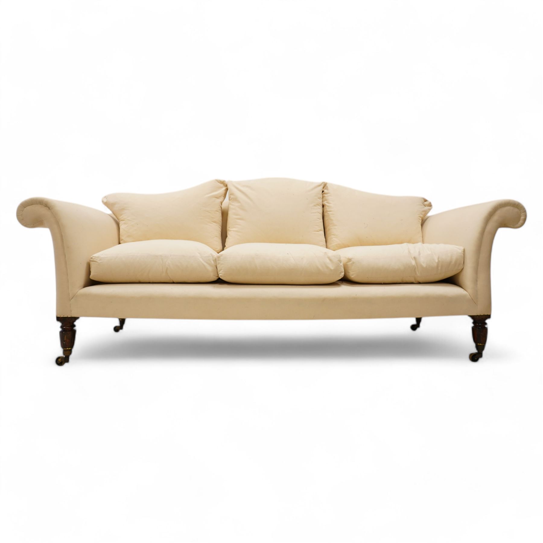 Grande three-seat camelback sofa, upholstered in calico base layer, on turned feet painted to resemble rosewood, fitted with brass cups and castors