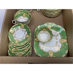 Minton Marlow pattern tea and dinner wares, including dinner plates, side plates, tea cups, cake plate, etc together with Bishops & Stonier 'Bisto' green and gilt tea wares and Maddock Ivory Ware dinner wares, in three boxes