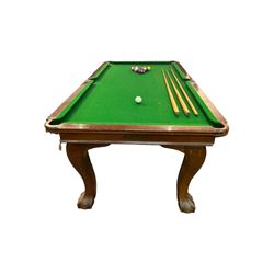 Riley - mahogany slate bed snooker dining table, green baize playing surface fitted with leather net pockets, raised on cabriole supports ending in ball and claw feet; together with set of Riley cues, balls and scoreboard