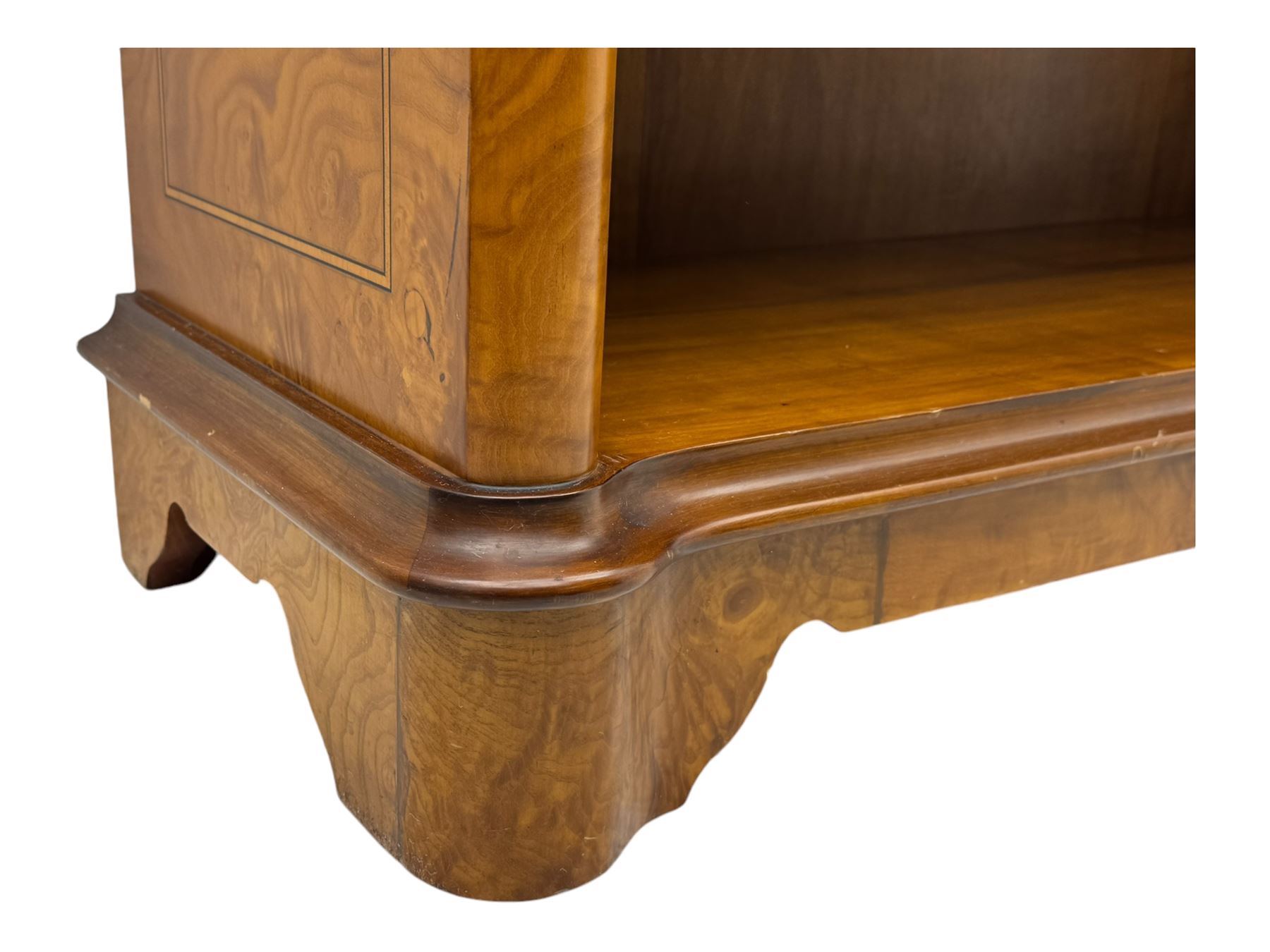 Figured walnut open bookcase, moulded top over two drawers and two shelves, on plinth base 