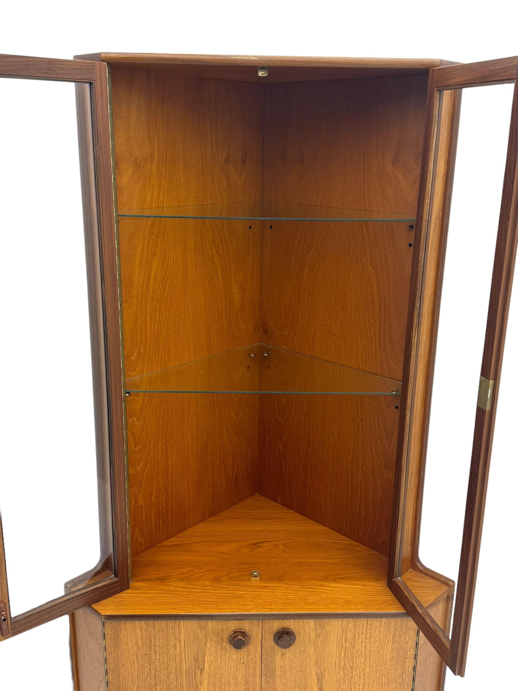 Nathan - teak corner display cabinet, double glazed doors enclosing two adjustable shelves over single cupboard.