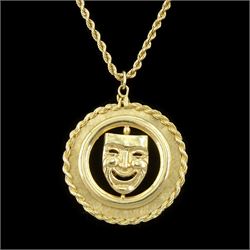 Gold swivel comedy tragedy mask pendant, stamped 14K, with rope twist border, on gold rope...