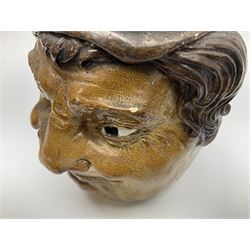 Rare early 20th century Martin Brothers stoneware tobacco jar and cover designed by Robert Wallace Martin, modelled in relief as a smirking face to one side, the other side modelled as the same subject wearing a quizzical expression, the cover formed as a sack hat, incised marks to base 'R W. Martin London & Southall. 10.1.1910', and to inner rim of cover 'R. W. Martin. & Bros London & Southall. 10.1.1910', H18cm

Cf. Waddington's Canada Lot 51 A Private Collection of Martin Brothers Stoneware 06/12/2017
Woolley & Wallace Lot 37 British Art Pottery 01/12/2010
