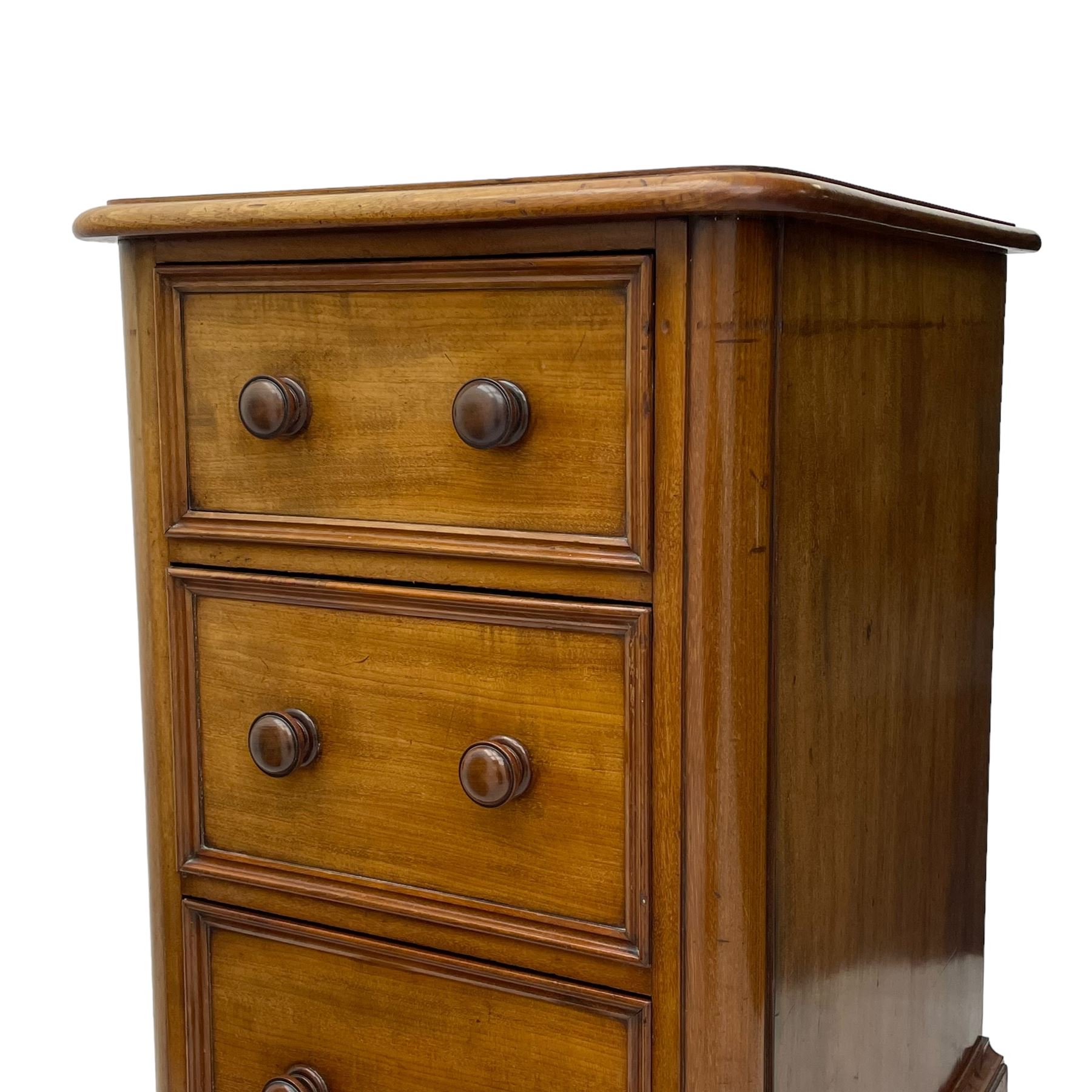 Pair of Victorian figured mahogany pedestal chests, rectangular form with rounded front corners, moulded top over three drawers with applied mouldings and turned handles, on moulded plinth base