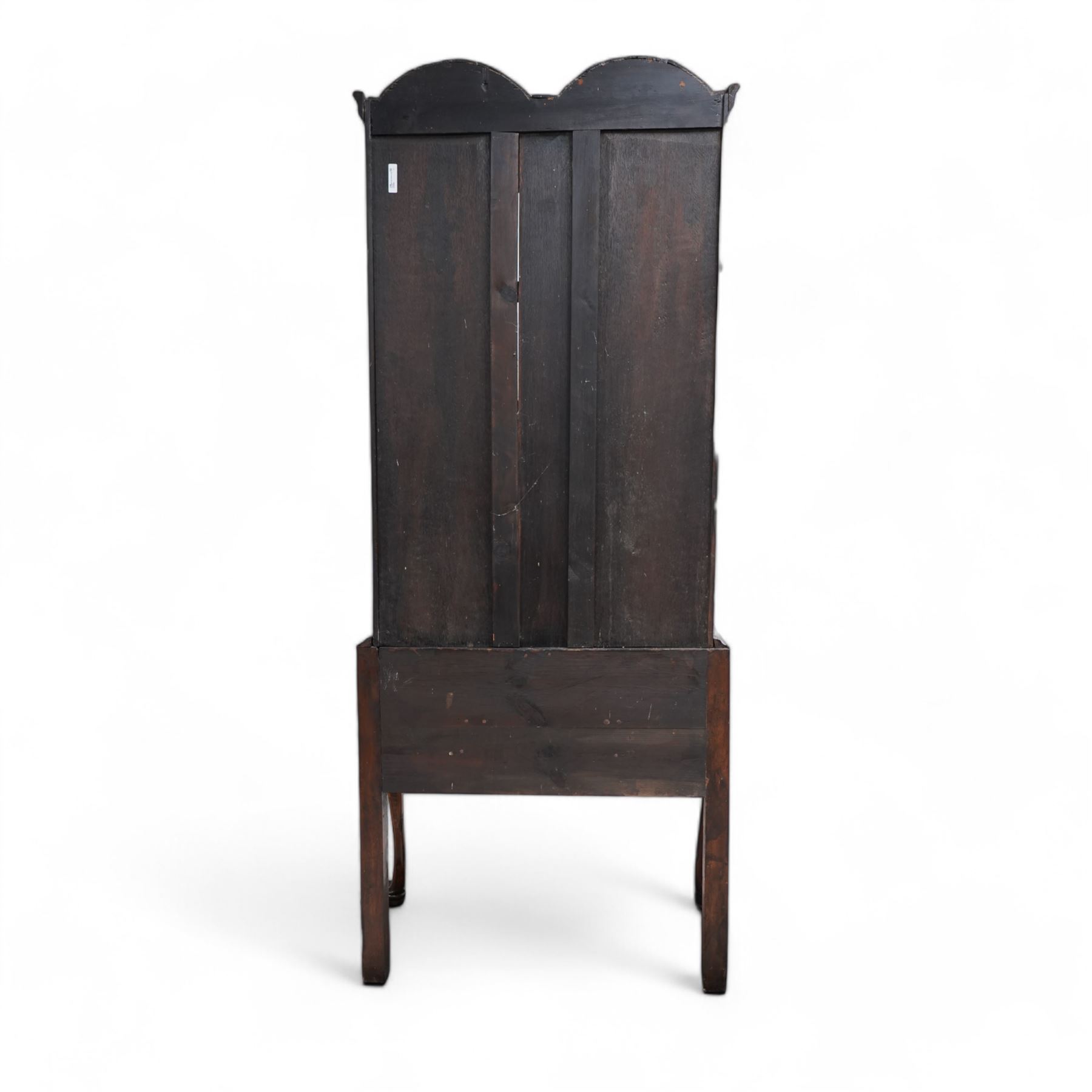 George II design walnut cabinet on stand, double arched top with applied mouldings over two astragal glazed doors, three internal shelves, the stand with moulded rectangular top fitted with three short drawers over shaped apron, on cabriole front supports 