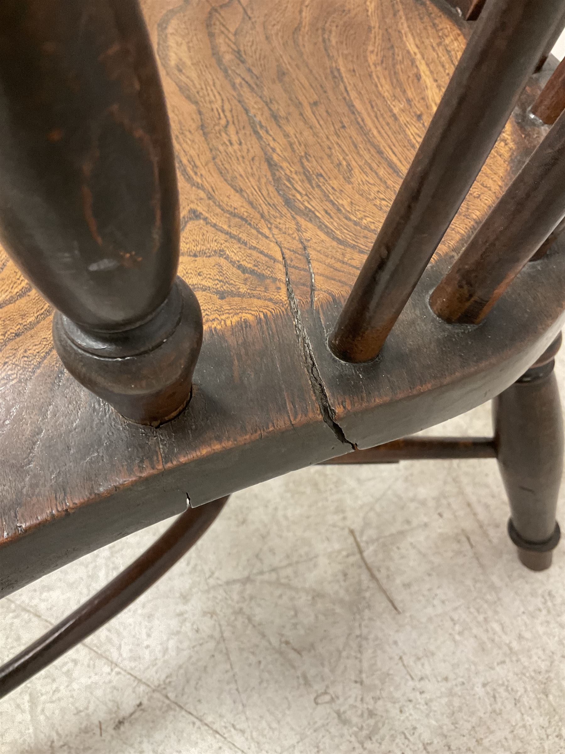 19th century yew wood and elm Windsor chair, low hoop stick back with pierced splat, dished seat raised on ring turned supports joined by crinoline stretcher