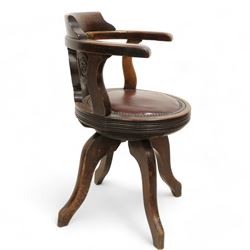 Early 20th century walnut 'P&O' swivel desk chair, curved back over shaped splat carved with monogram 'P&O', circular moulded seat with leather upholstery and stud band, on four high shaped and splayed supports