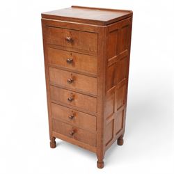 Mouseman - adzed oak pedestal chest, fitted with six drawers each with turned handle, pane...