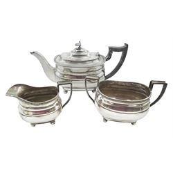 1930s silver three piece tea service, comprising teapot, open sucrier and milk jug, each of oval form with oblique gadrooned rim, the teapot with Bakelite handle and finial, hallmarked James Dixon & Sons Ltd, Sheffield 1932