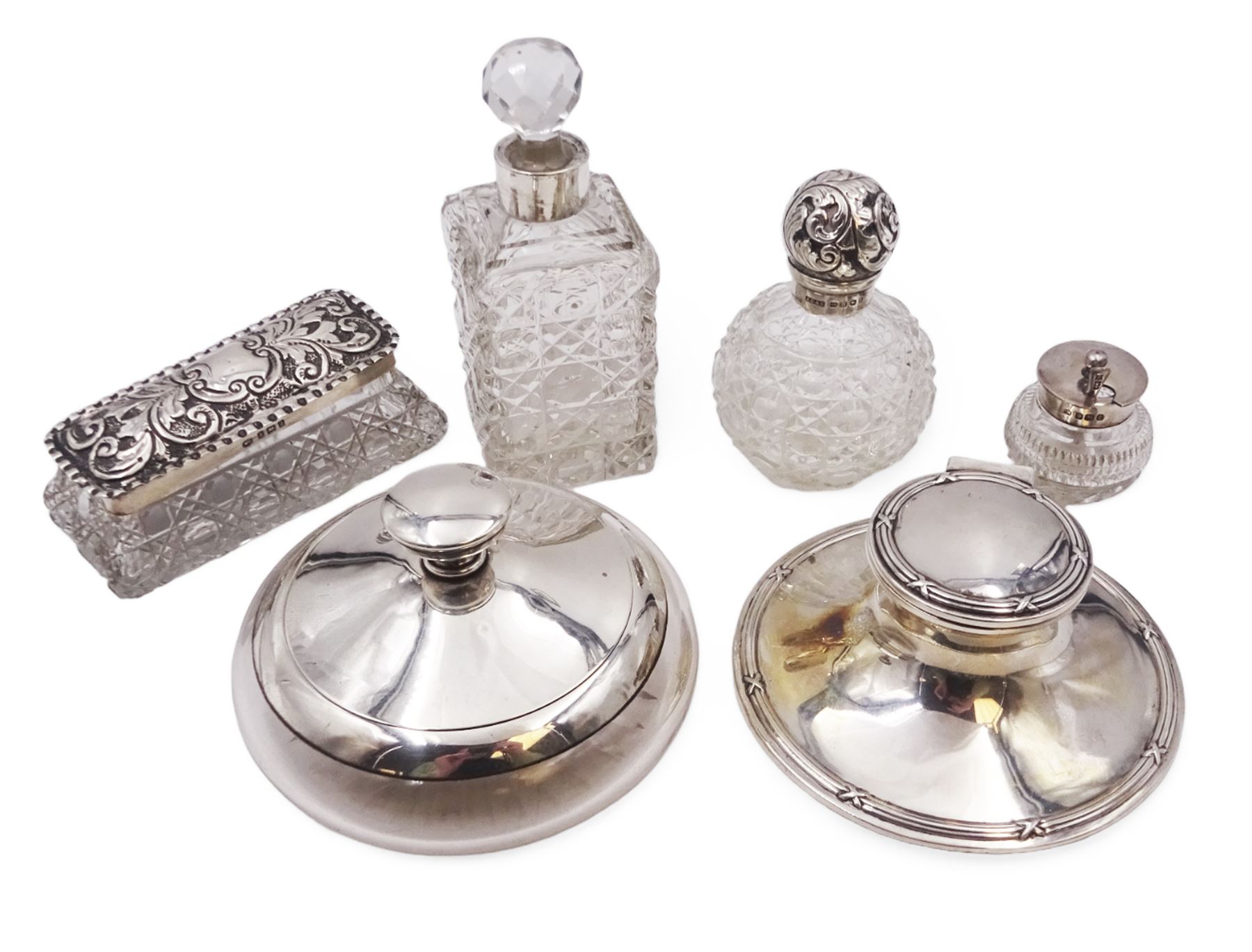 Edwardian silver mounted capstan inkwell, hallmarked A & J Zimmerman Ltd, Birmingham 1905, together with a group of silver mounted cut glass items including scent bottles, mustard pot and dressing table jars with silver collars/lids, all hallmarked 