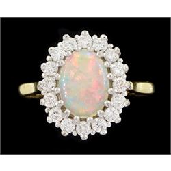 18ct gold opal and round brilliant cut diamond cluster ring, hallmarked, opal 0.66 carat, total diamond weight 0.36 carat