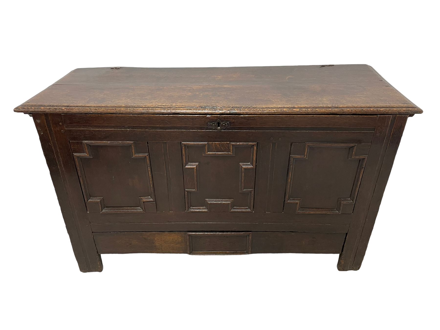 18th century oak mule chest, rectangular hinged top with moulded edge enclosing candle box, the triple panelled front with geometric fielded mouldings, fitted with single drawer to base, raised on stile feet