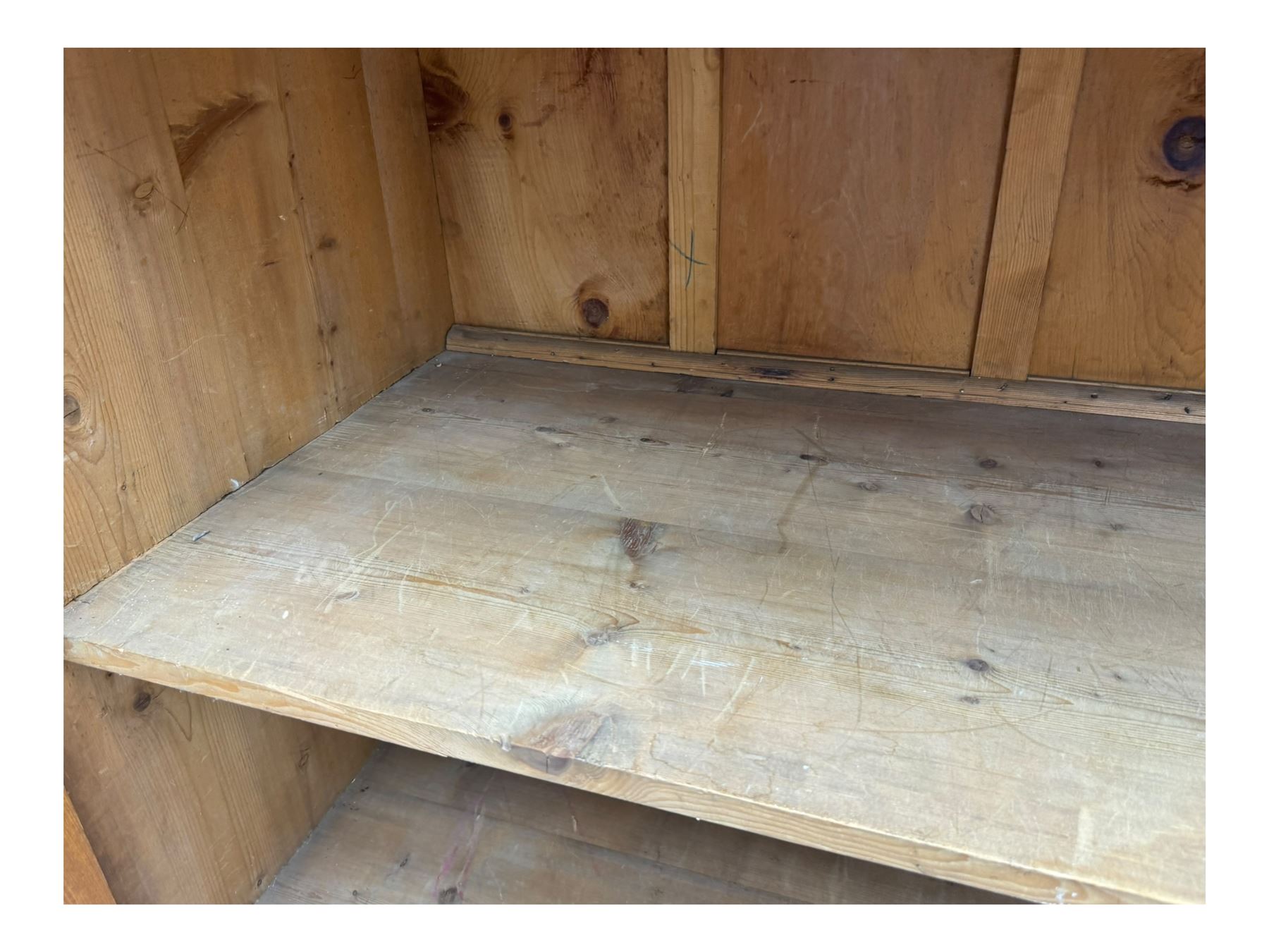 Large 19th century pine cupboard, rectangular top over two panelled later doors, enclosing four open shelves, on plinth base