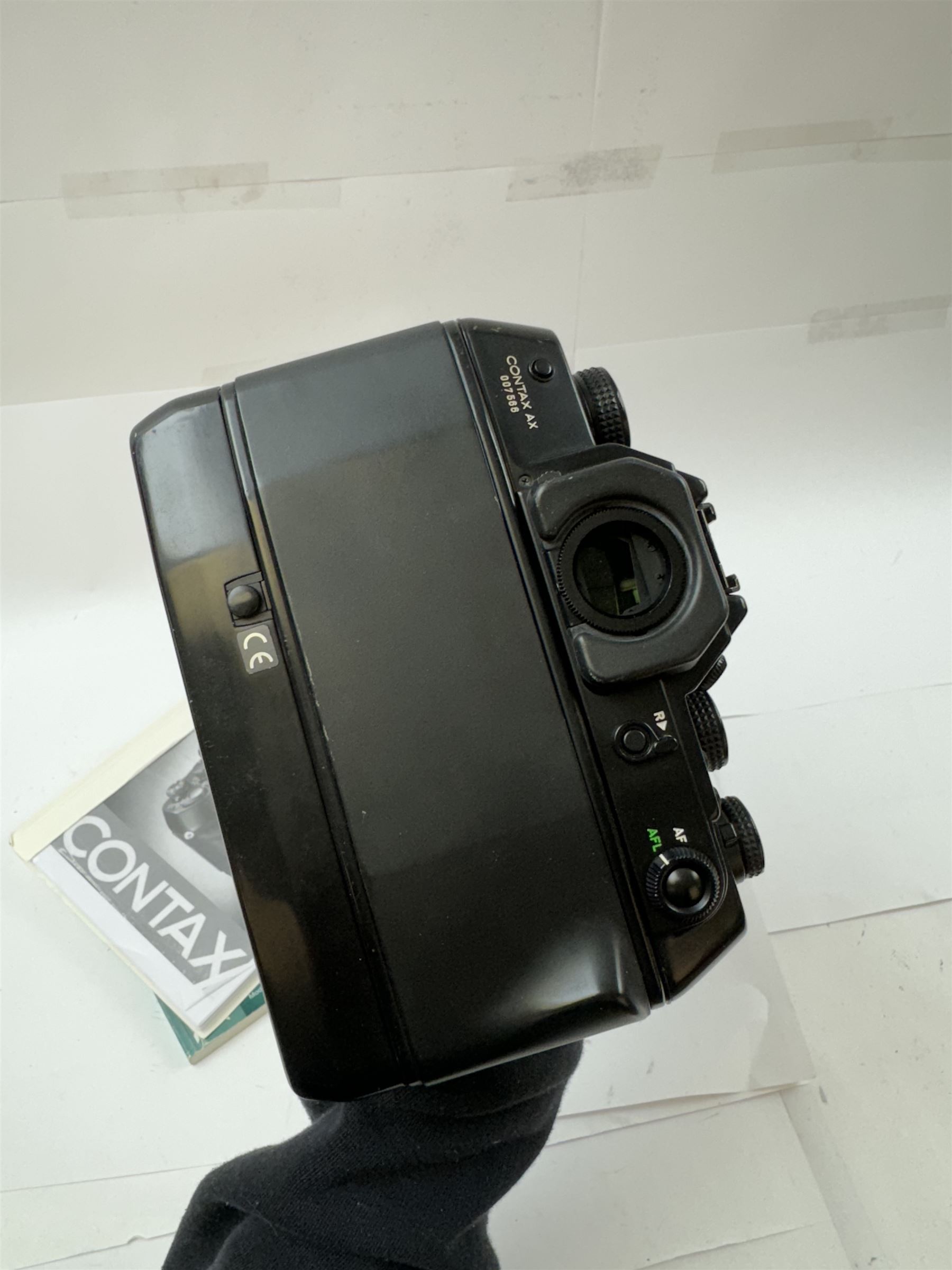 Contax AX SLR camera serial no. 007566, with a Carl Zeiss Planar 1.4/50 T* lens serial no. 7192099, 