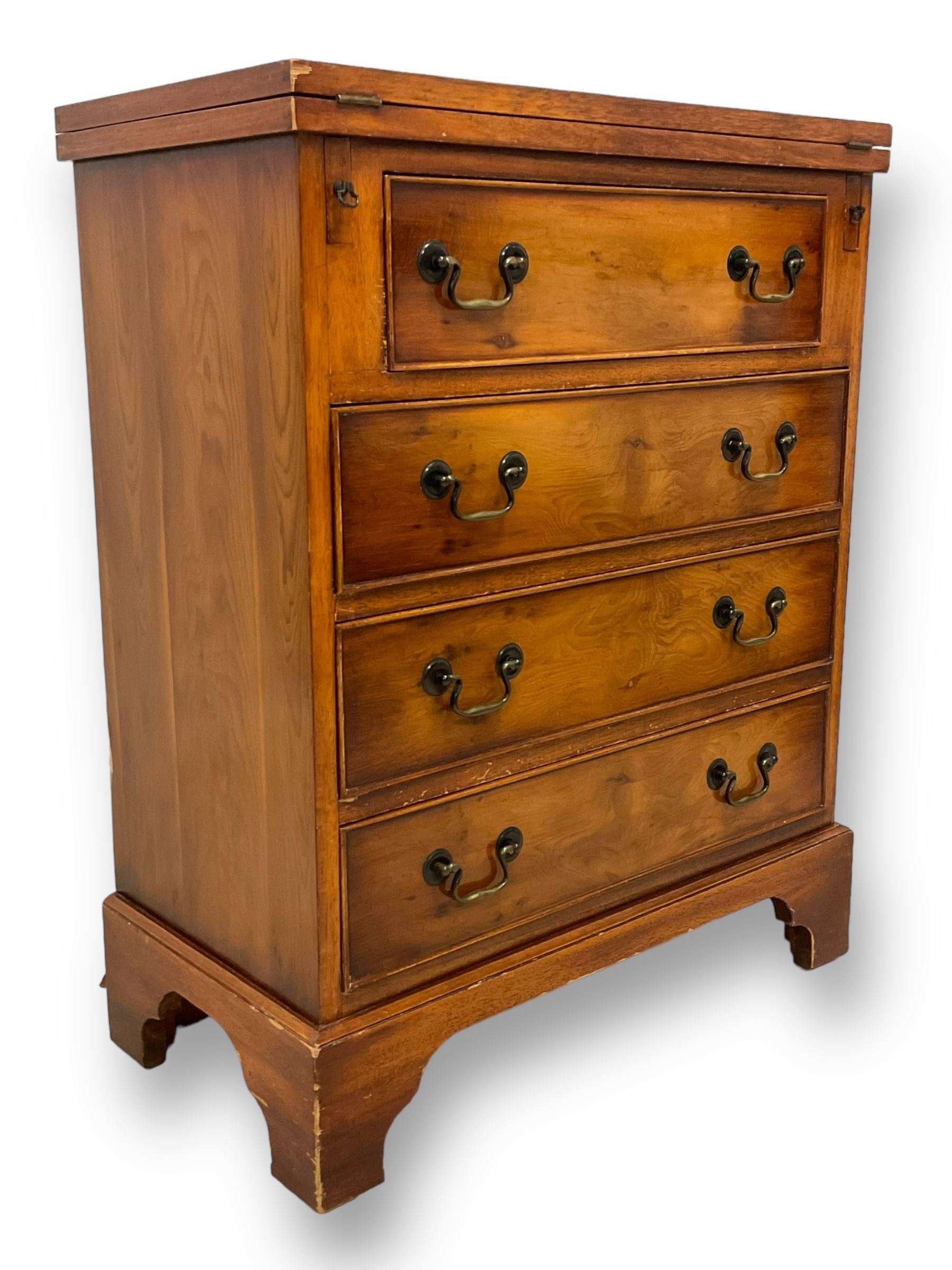 Georgian design yew wood bachelor's chest, fold-over rectangular top supported by pull-out stays, fitted with four long cock-beaded drawers, on bracket feet