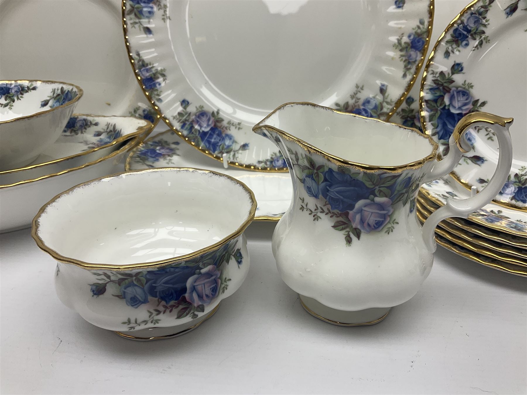 Royal Albert Moonlight Rose pattern tea service for six, comprising teacups and saucers, open sucrier, milk jug, dessert plates and cake plate, together with six other dinners wares in the same pattern