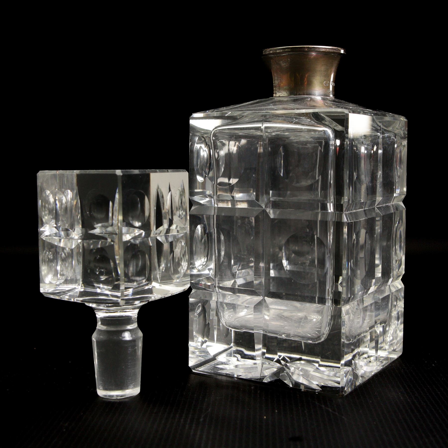 Square glass spirit decanter with silver collar and square stopper and two other decanters with silver collars (3)